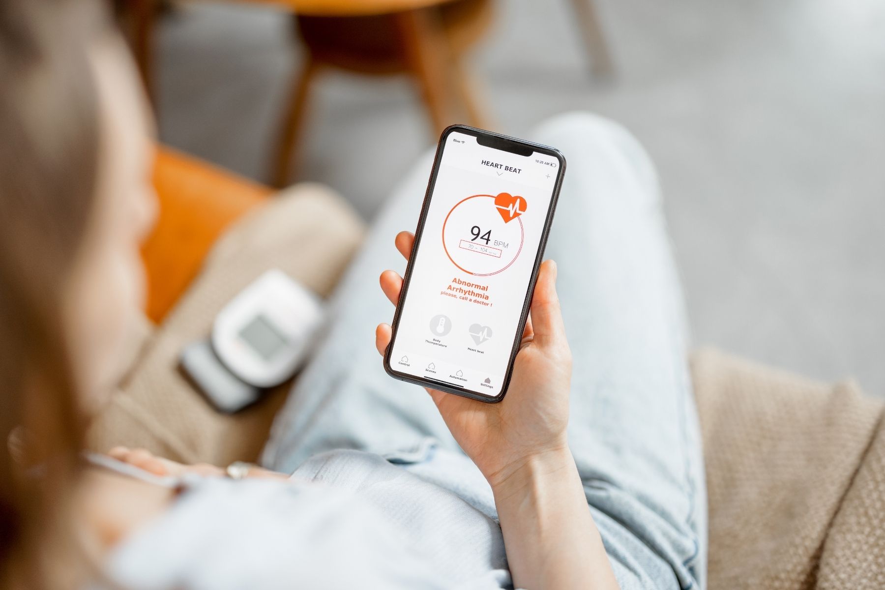 woman checking her heart rate in an app