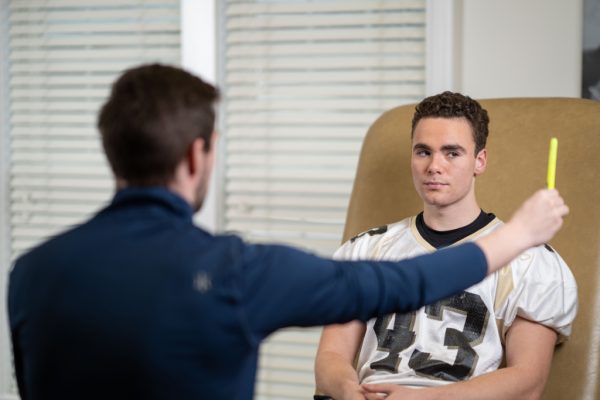 male getting concussion tested