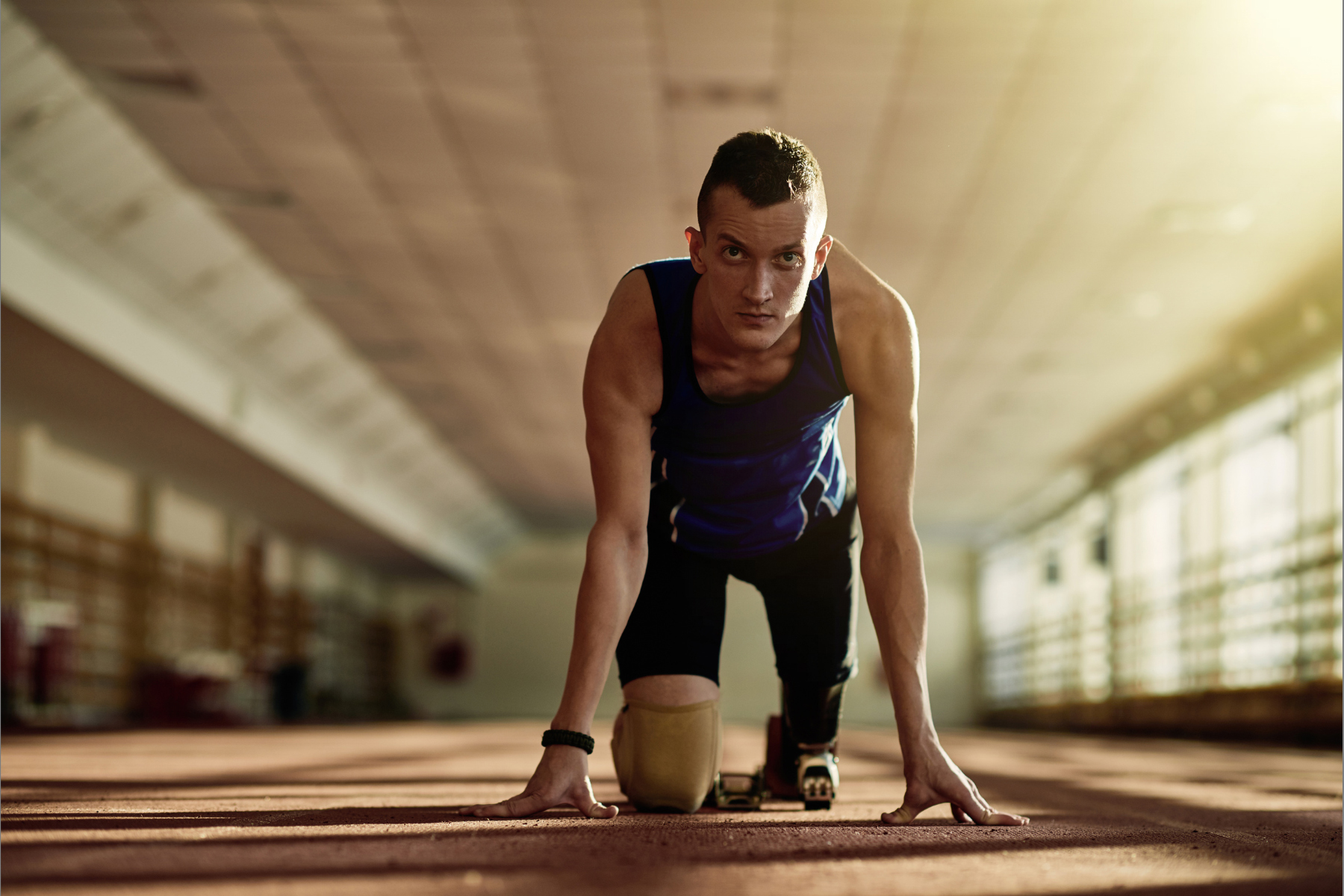 man getting ready for a track race