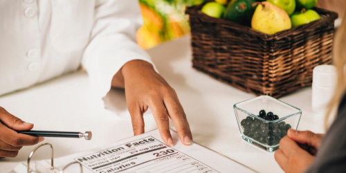 woman showing a nutrition label