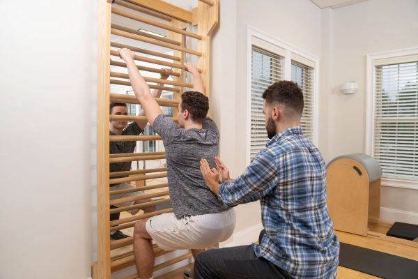 physical therapist using the schroth method to treat a client with scoliosis